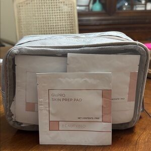 BeautyBio GloPRO Skin Prep Pads (170 pads) with makeup bag.